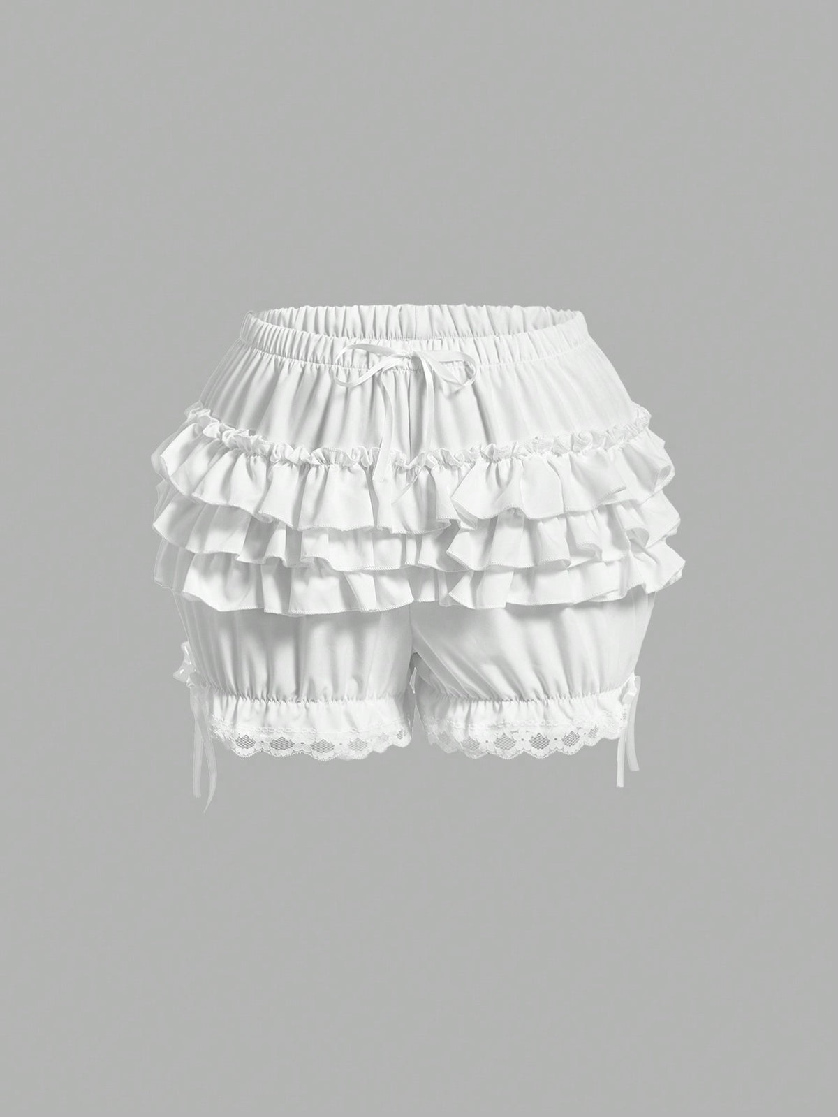 Women's tiered ruffle skort shorts featuring an elastic mid waist with front tie knot detail in woven fabric.