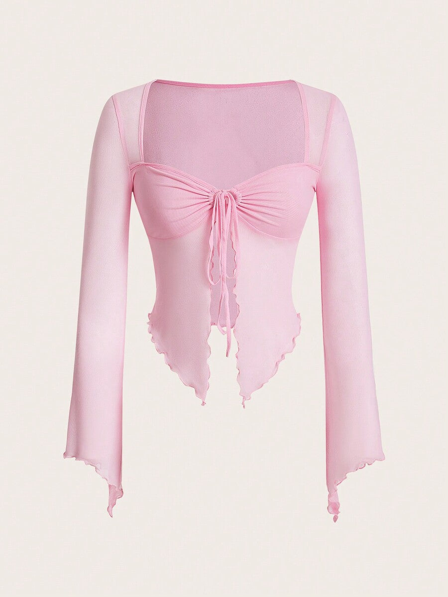 Semi-sheer mesh top featuring a sweetheart neckline with front knot detail, long flare sleeves, lined body, and an asymmetrical hem.