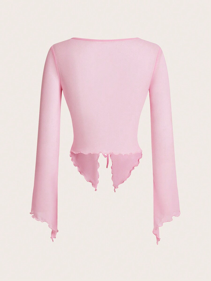 Semi-sheer mesh top featuring a sweetheart neckline with front knot detail, long flare sleeves, lined body, and an asymmetrical hem.