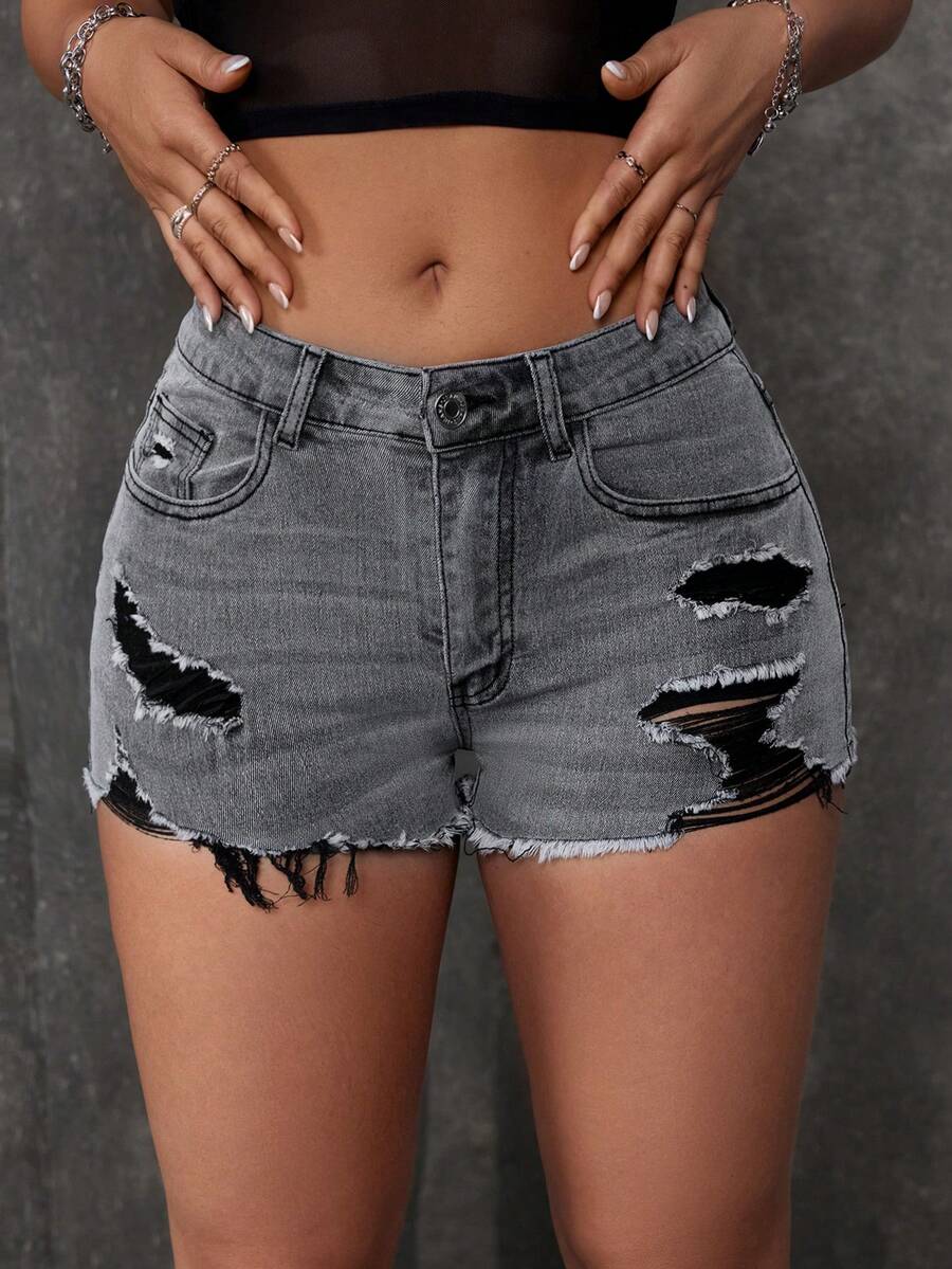 Women's solid color shorts with zipper fly, button closure, pockets, ripped details, and raw hem in a casual straight-leg short length