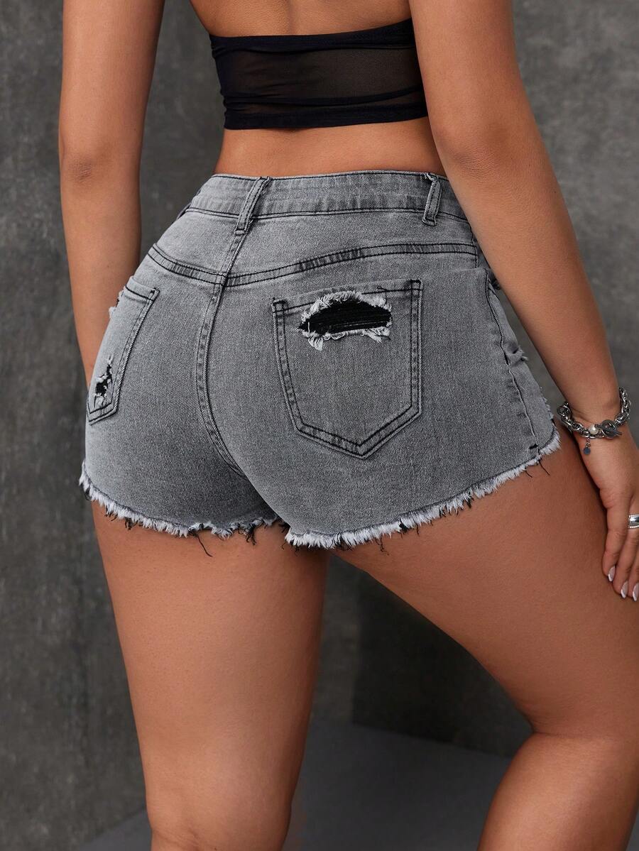 Women's solid color shorts with zipper fly, button closure, pockets, ripped details, and raw hem in a casual straight-leg short length