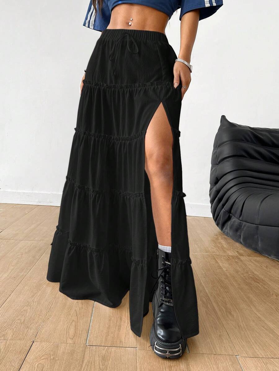 Women's black maxi bubble skirt featuring a high thigh split, lettuce ruffle trim, and a relaxed flared silhouette.