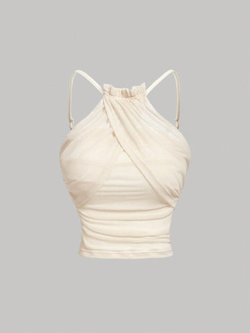 Women's apricot ruched crop tank top featuring spaghetti straps, frill details, and a slim fit design.