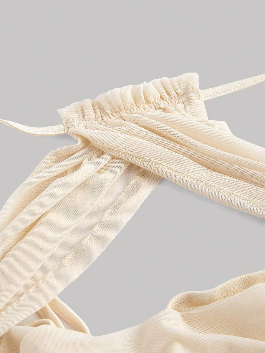 Women's apricot ruched crop tank top featuring spaghetti straps, frill details, and a slim fit design.