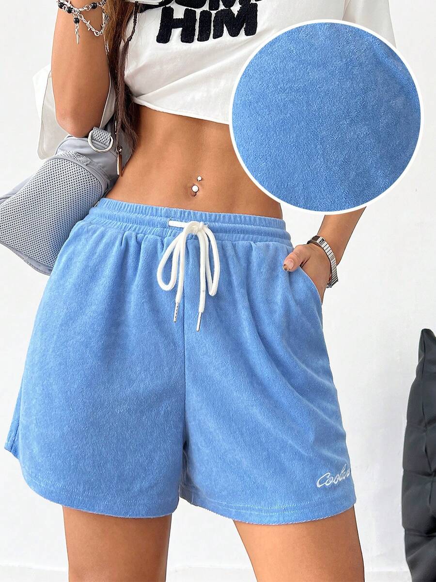 Women's casual drawstring track shorts featuring front pockets and embroidered details
