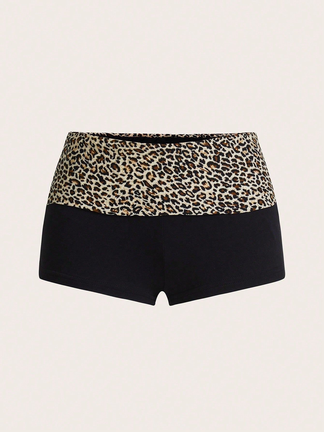 Leopard print foldover waist ultra low rise mini shorts with elastic waistband, skinny fit, and short length.