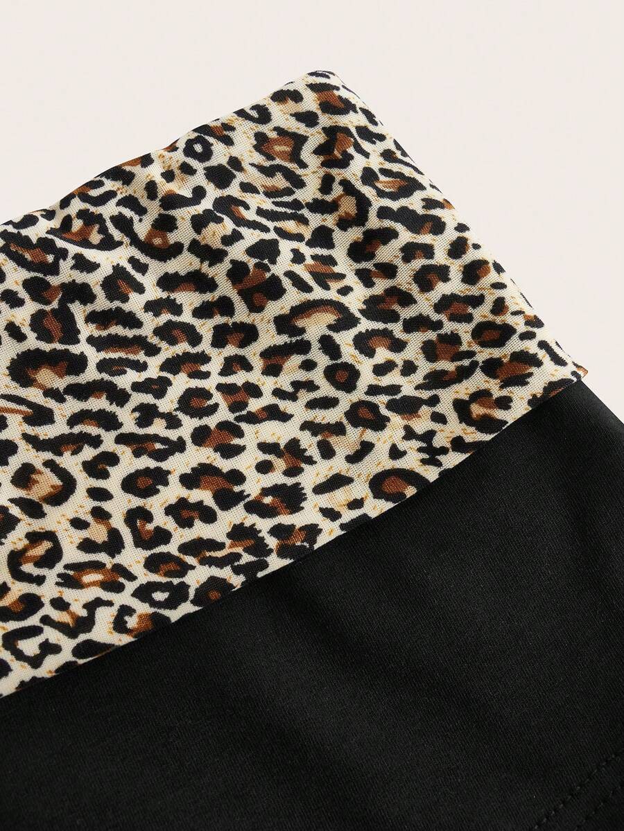 Leopard print foldover waist ultra low rise mini shorts with elastic waistband, skinny fit, and short length.