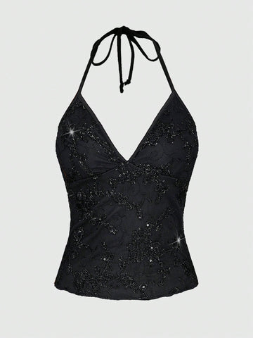 Mesh lace halter top with contrast sequin floral vine embroidery, backless knot detail, and regular fit styling for party, stage, concert, or Halloween looks.
