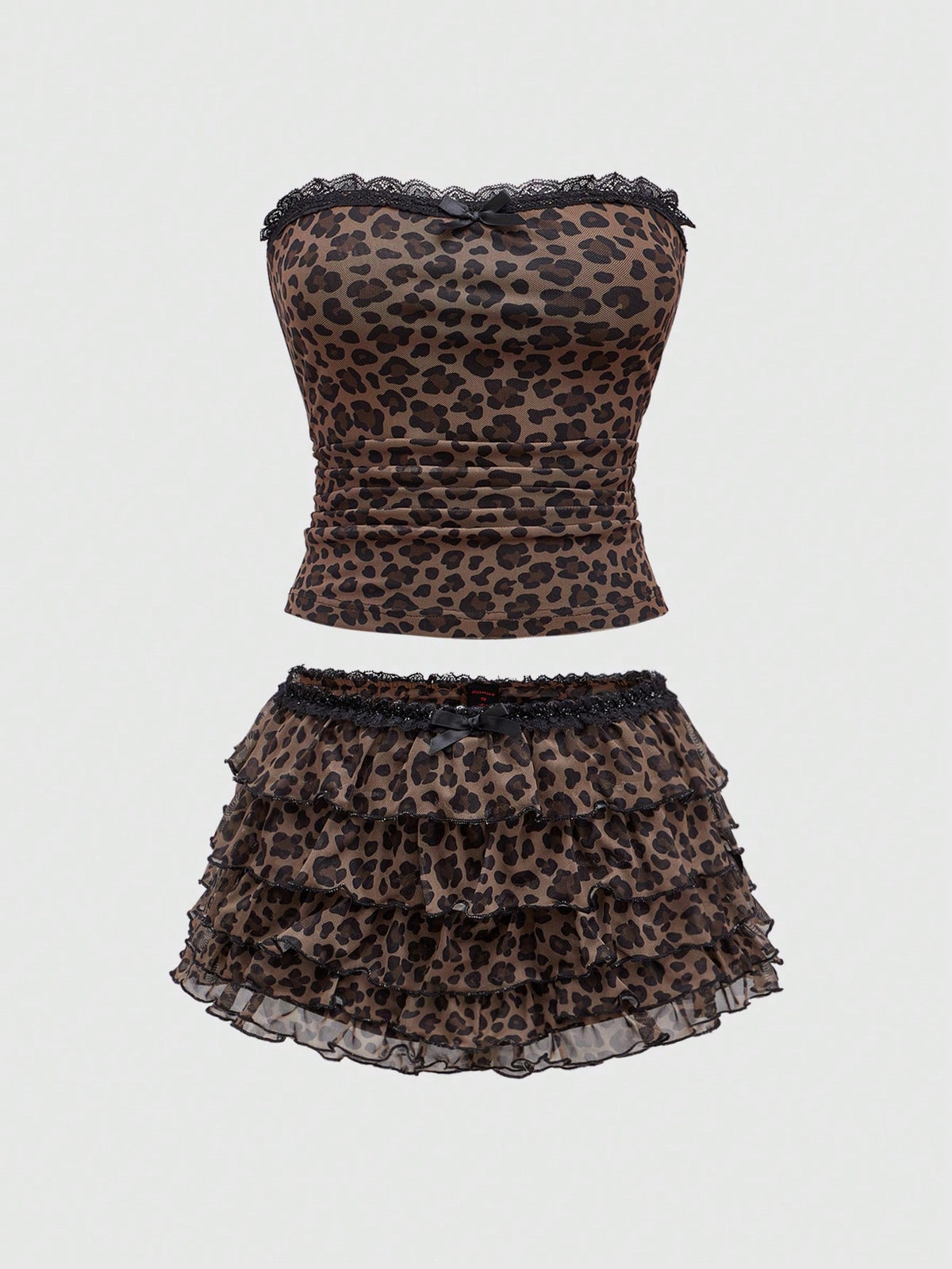 Y2K leopard print two-piece outfit with strapless bandeau top and ruffle mini shorts, featuring contrast lace and a slim fit