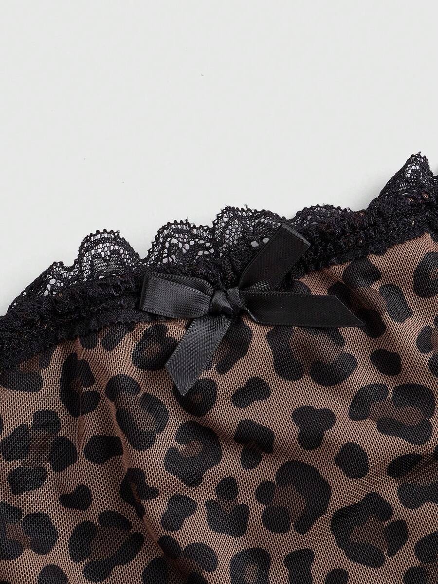 Y2K leopard print two-piece outfit with strapless bandeau top and ruffle mini shorts, featuring contrast lace and a slim fit