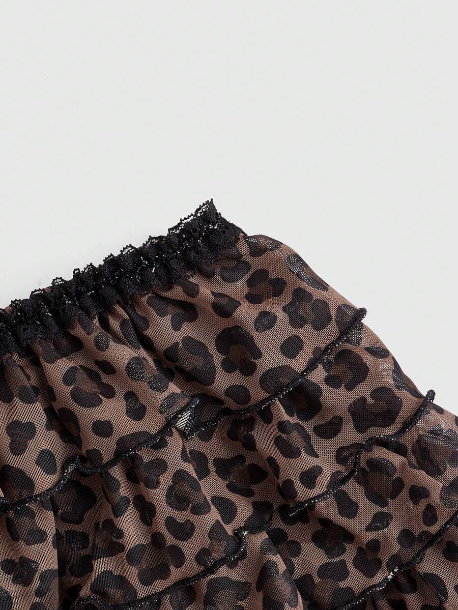 Y2K leopard print two-piece outfit with strapless bandeau top and ruffle mini shorts, featuring contrast lace and a slim fit