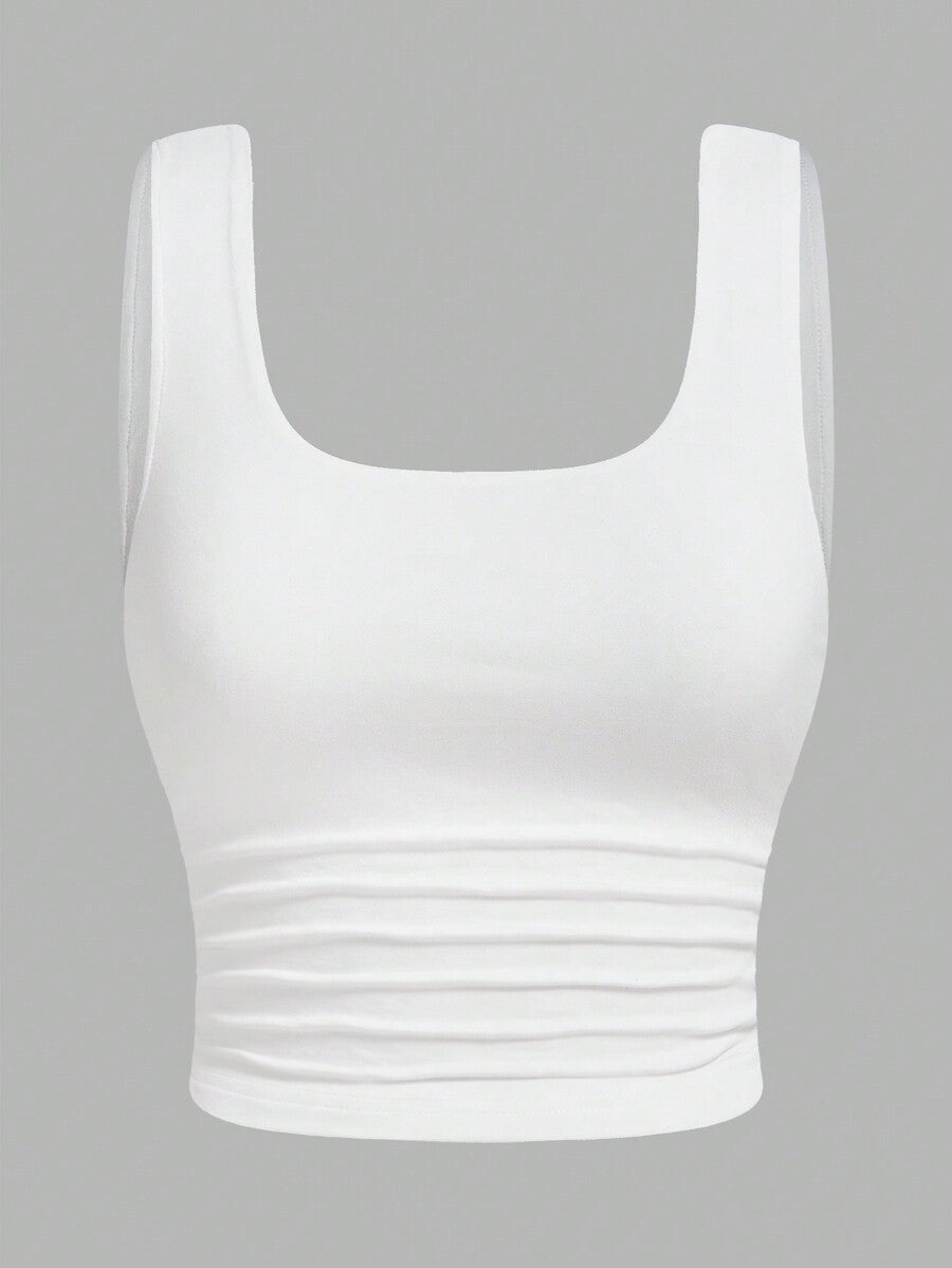Women's knitted slim fit crop camisole tank top featuring a scoop neck and ruched detailing.