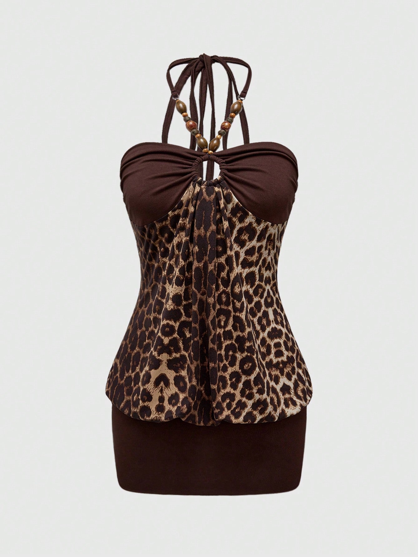 Women's Y2K halter neck leopard print bodycon mini dress with beaded decor, patchwork design, backless knot detail, slim fit, and sleeveless mini length.