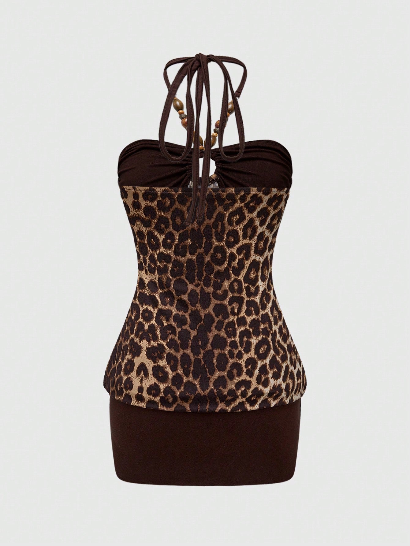 Women's Y2K halter neck leopard print bodycon mini dress with beaded decor, patchwork design, backless knot detail, slim fit, and sleeveless mini length.