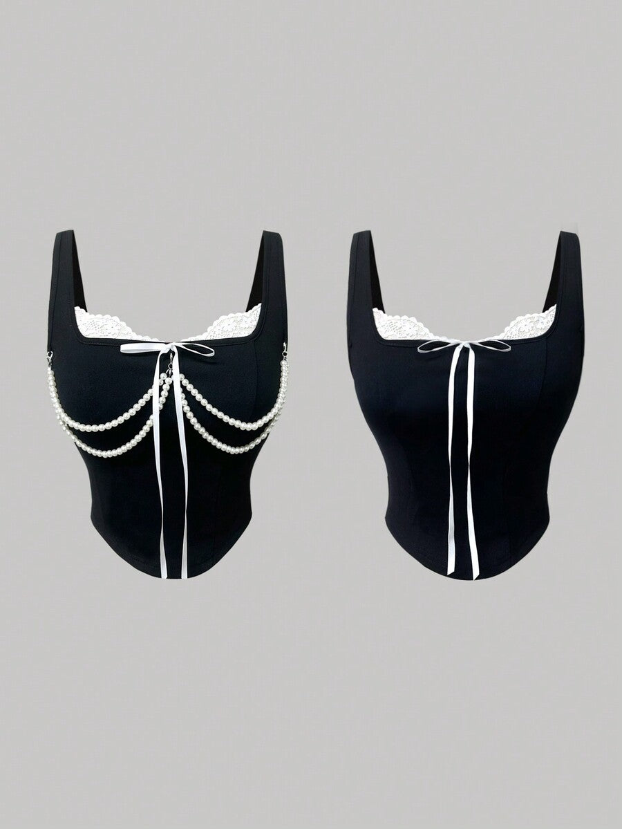 women's black wide-strap tank top featuring a lace collar, detachable bow chain decor with pearl details, and an asymmetrical hem.
