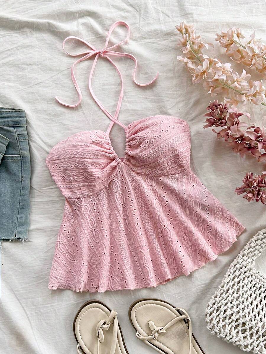 Women's textured V-neck halter tank top with backless knot detail, ruffle hem, and flared silhouette for casual beach and vacation wear.