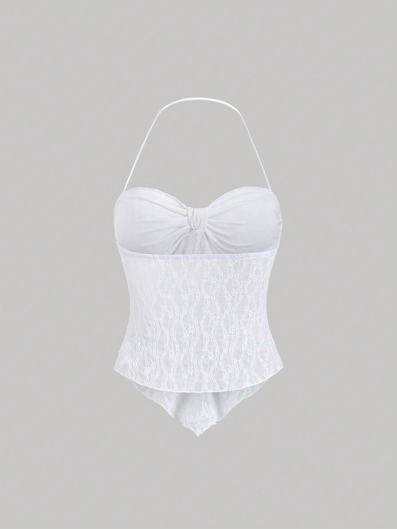 Women's black lace halter crop top with contrast bow front, backless styling, semi-sheer finish, and asymmetrical hem