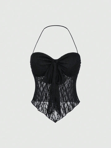 Women's black lace halter crop top with contrast bow front, backless styling, semi-sheer finish, and asymmetrical hem