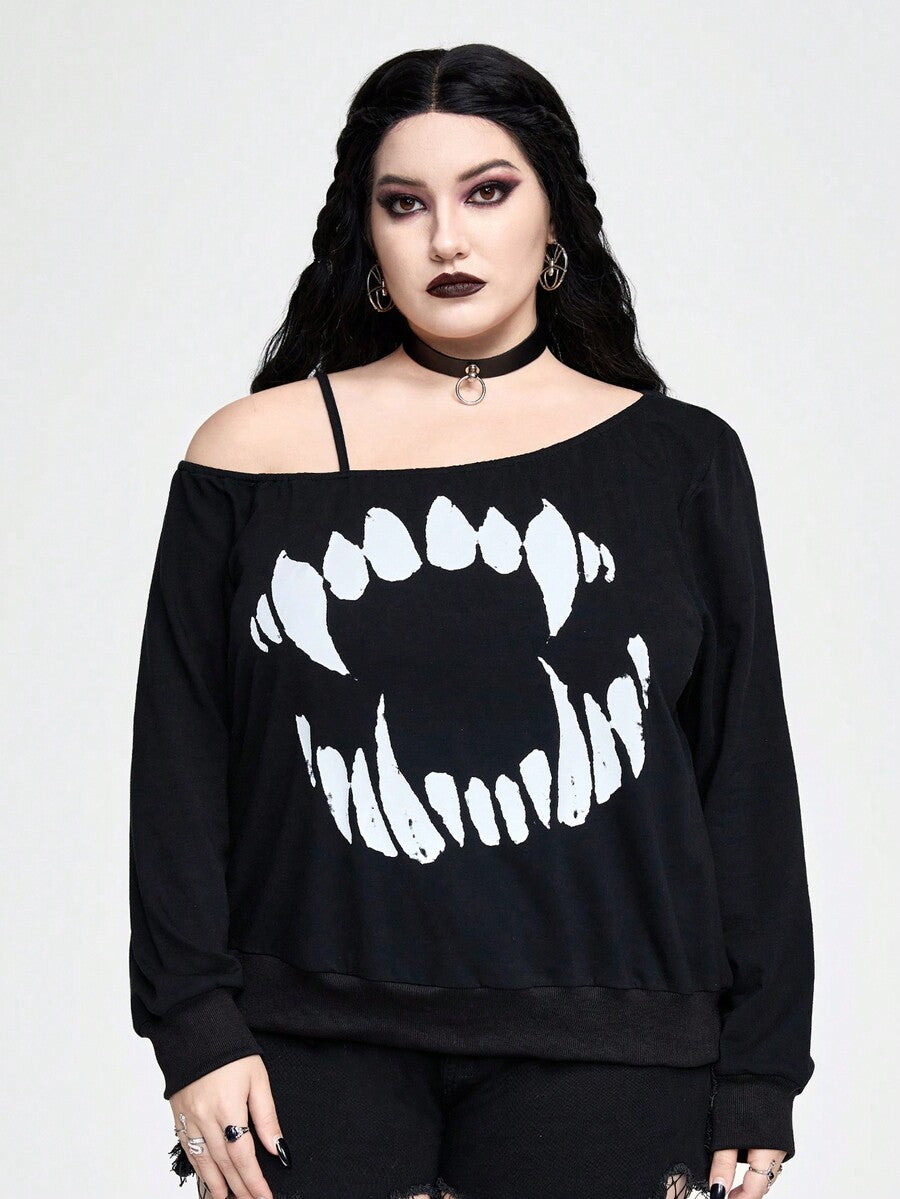 Black women's loose long sleeve gothic sweatshirt with an asymmetrical neckline, strap detail, and fang graphic print.