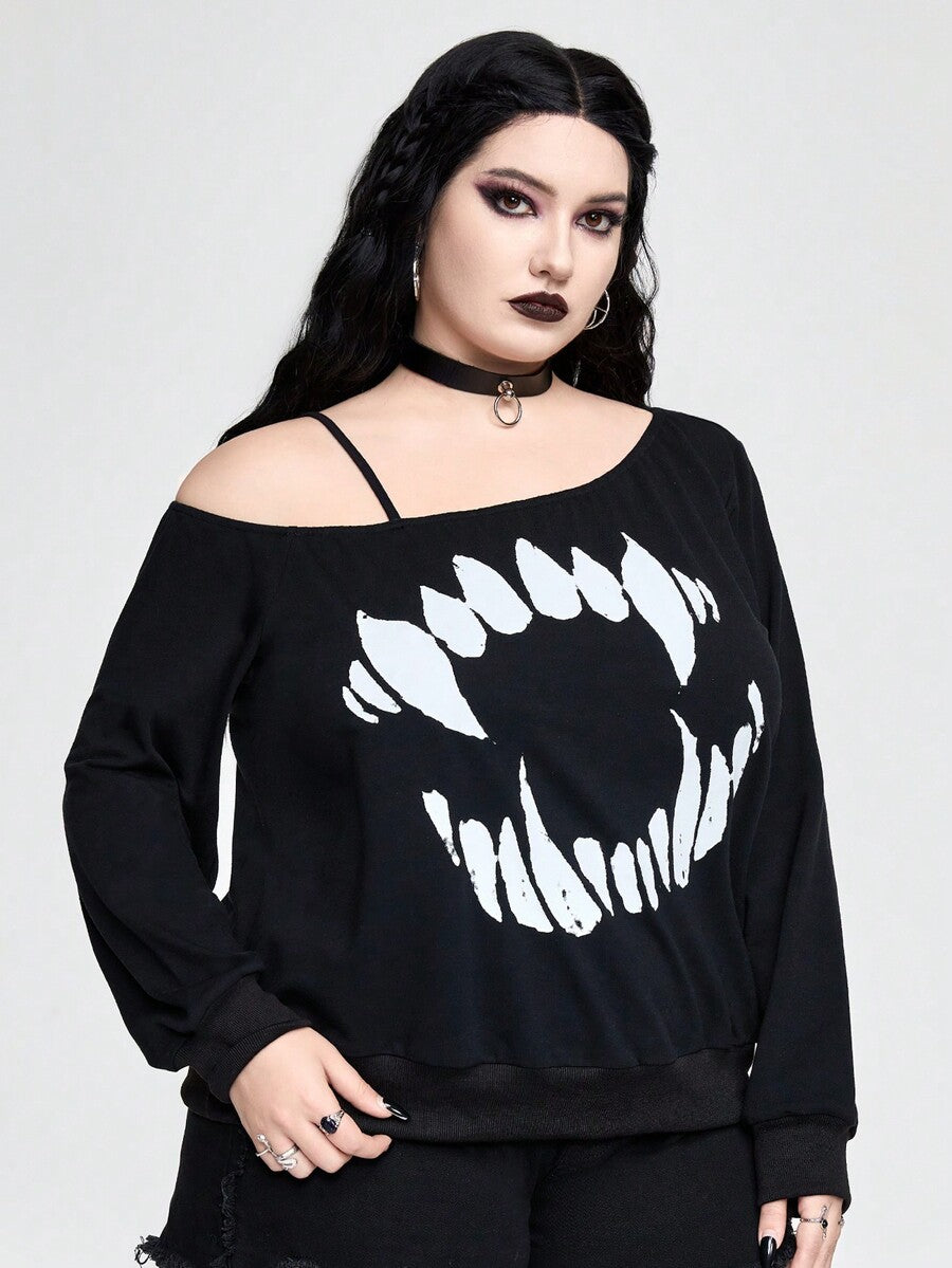 Black women's loose long sleeve gothic sweatshirt with an asymmetrical neckline, strap detail, and fang graphic print.