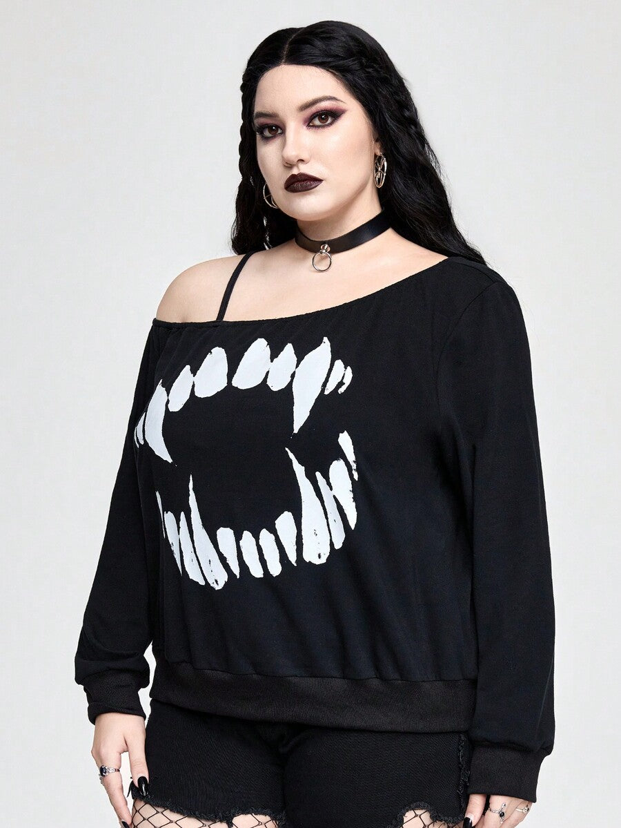 Black women's loose long sleeve gothic sweatshirt with an asymmetrical neckline, strap detail, and fang graphic print.