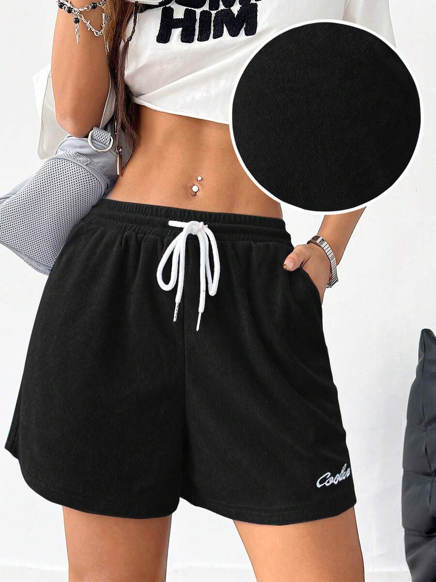 Women's casual drawstring track shorts featuring front pockets and embroidered details