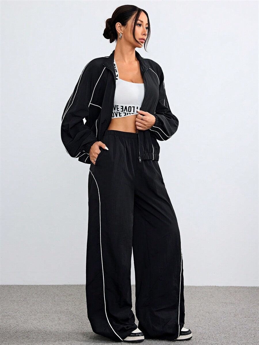 Women's black casual reflective windbreaker sports set featuring a loose stand collar zip jacket and matching unlined pants.