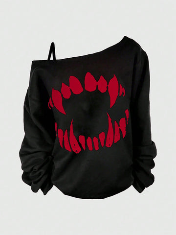 Black women's loose long sleeve gothic sweatshirt with an asymmetrical neckline, strap detail, and fang graphic print.