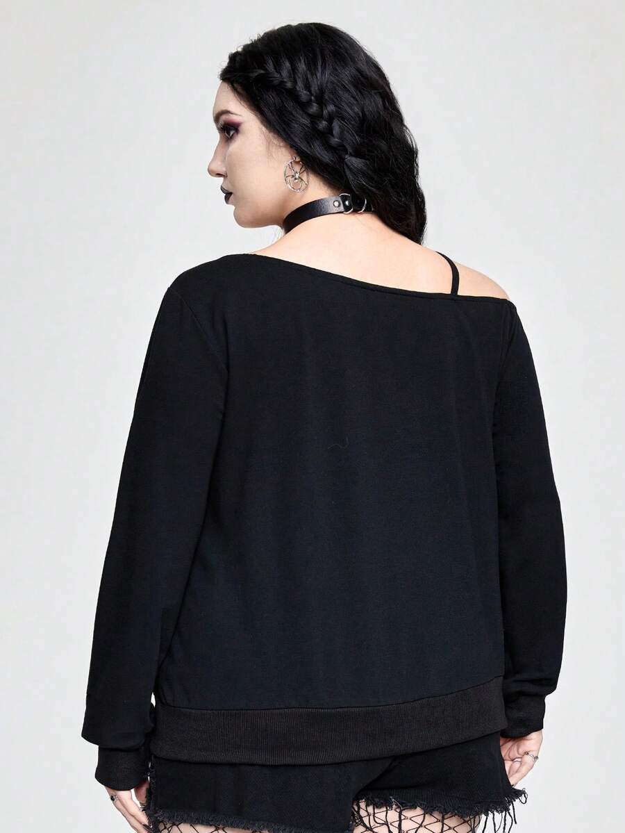 Black women's loose long sleeve gothic sweatshirt with an asymmetrical neckline, strap detail, and fang graphic print.