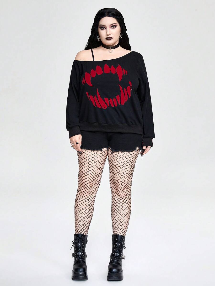 Black women's loose long sleeve gothic sweatshirt with an asymmetrical neckline, strap detail, and fang graphic print.