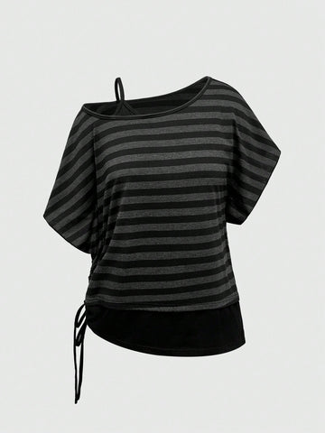 Women's striped t-shirt featuring an asymmetric cold shoulder neckline, batwing short sleeves, and ruched drawstring details in a loose knit fit.