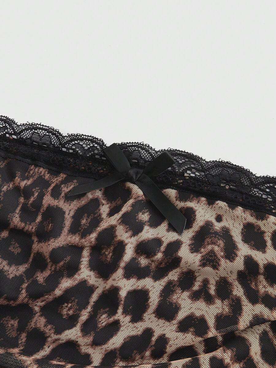 Y2K leopard print two-piece outfit with strapless bandeau top and ruffle mini shorts, featuring contrast lace and a slim fit
