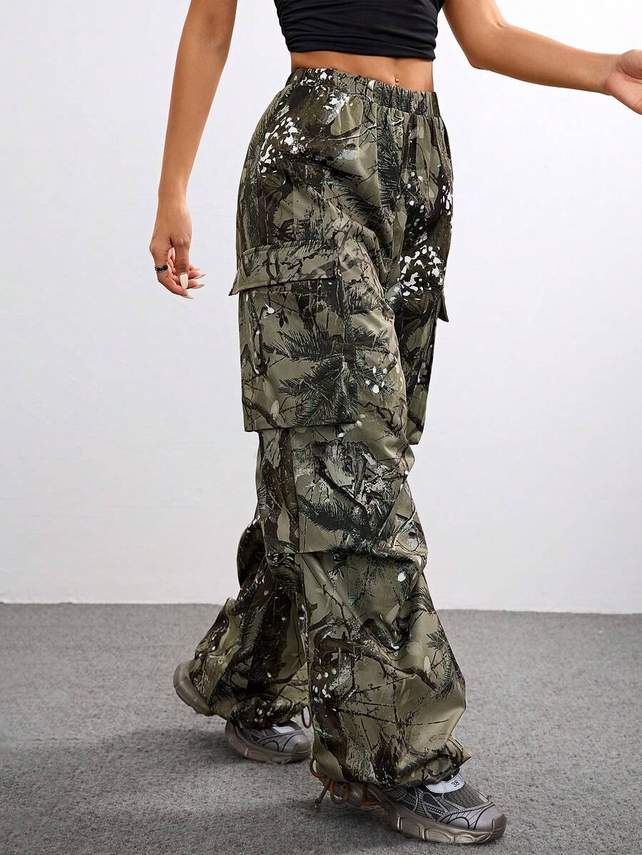 Women's high waist wide leg cargo pants featuring a black and white tree branch print and adjustable drawstring closure.