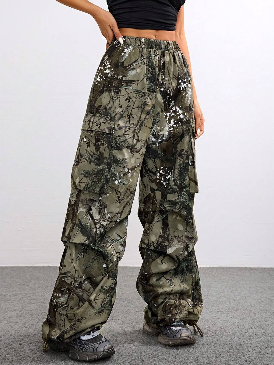 Women's high waist wide leg cargo pants featuring a black and white tree branch print and adjustable drawstring closure.
