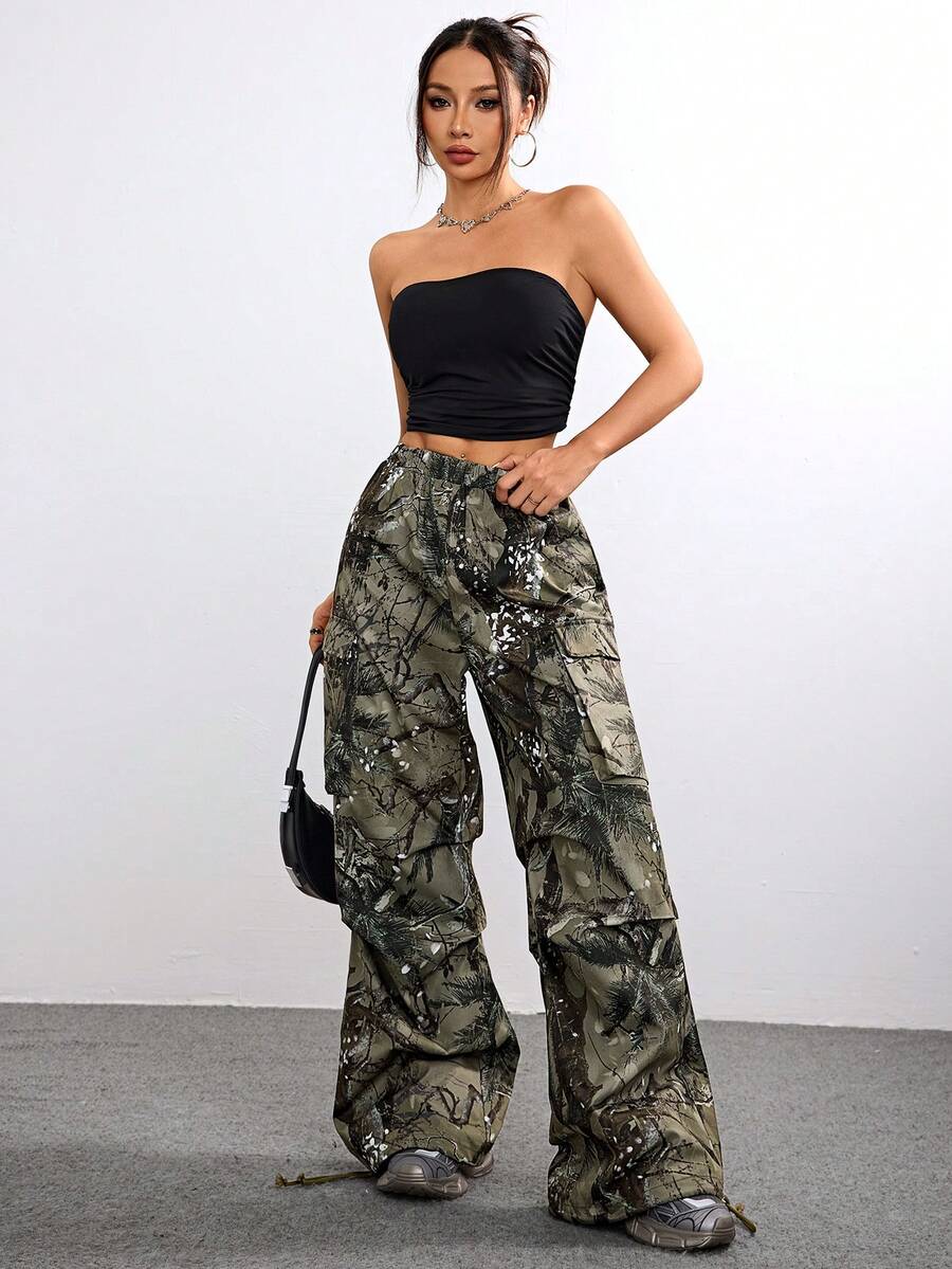 Women's high waist wide leg cargo pants featuring a black and white tree branch print and adjustable drawstring closure.