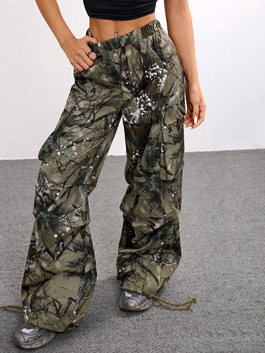 Women's high waist wide leg cargo pants featuring a black and white tree branch print and adjustable drawstring closure.