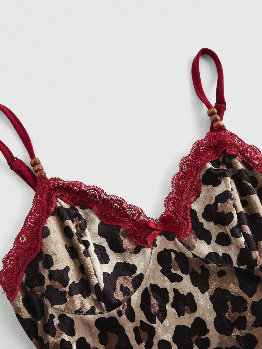 Women's sleeveless leopard print halter cocktail dress featuring contrast lace details, a backless cut, high waist, and a mermaid ruffle hem.