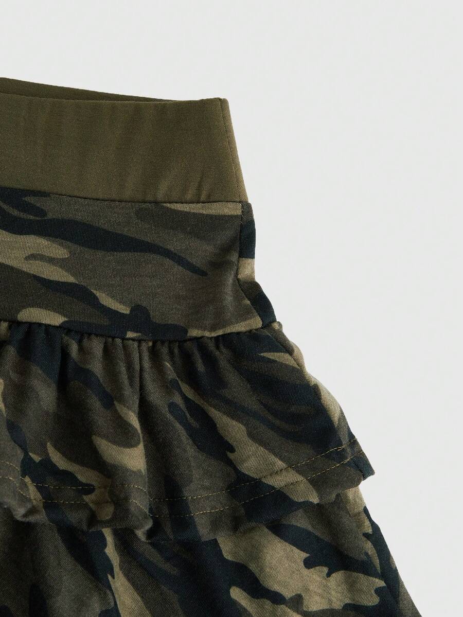 Multicolor camo print two-piece outfit with strapless bandeau crop top and matching ruched tiered mini skirt with ruffle hem.