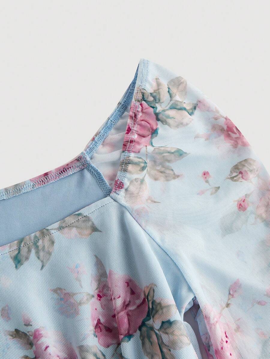 Women's polka dot mesh T-shirt with long flare sleeves, square neckline, bow detail, and asymmetric ruffle hem.