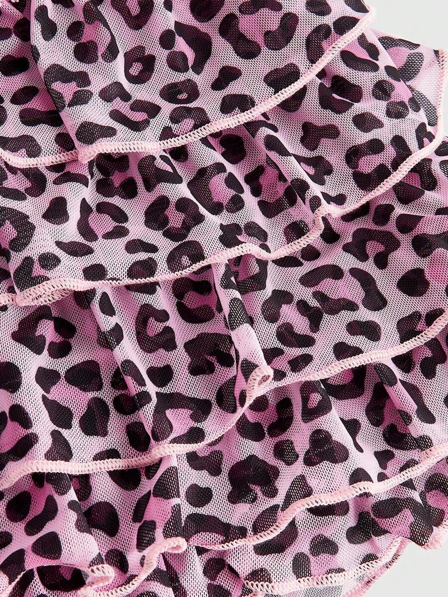 Y2K leopard print two-piece outfit with strapless bandeau top and ruffle mini shorts, featuring contrast lace and a slim fit