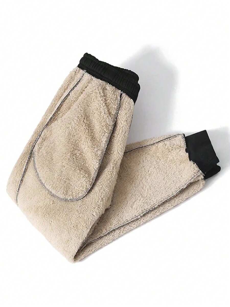 Women's black casual sweatpants featuring an adjustable drawstring waistband, loose straight cut, and soft warm knitted fabric.