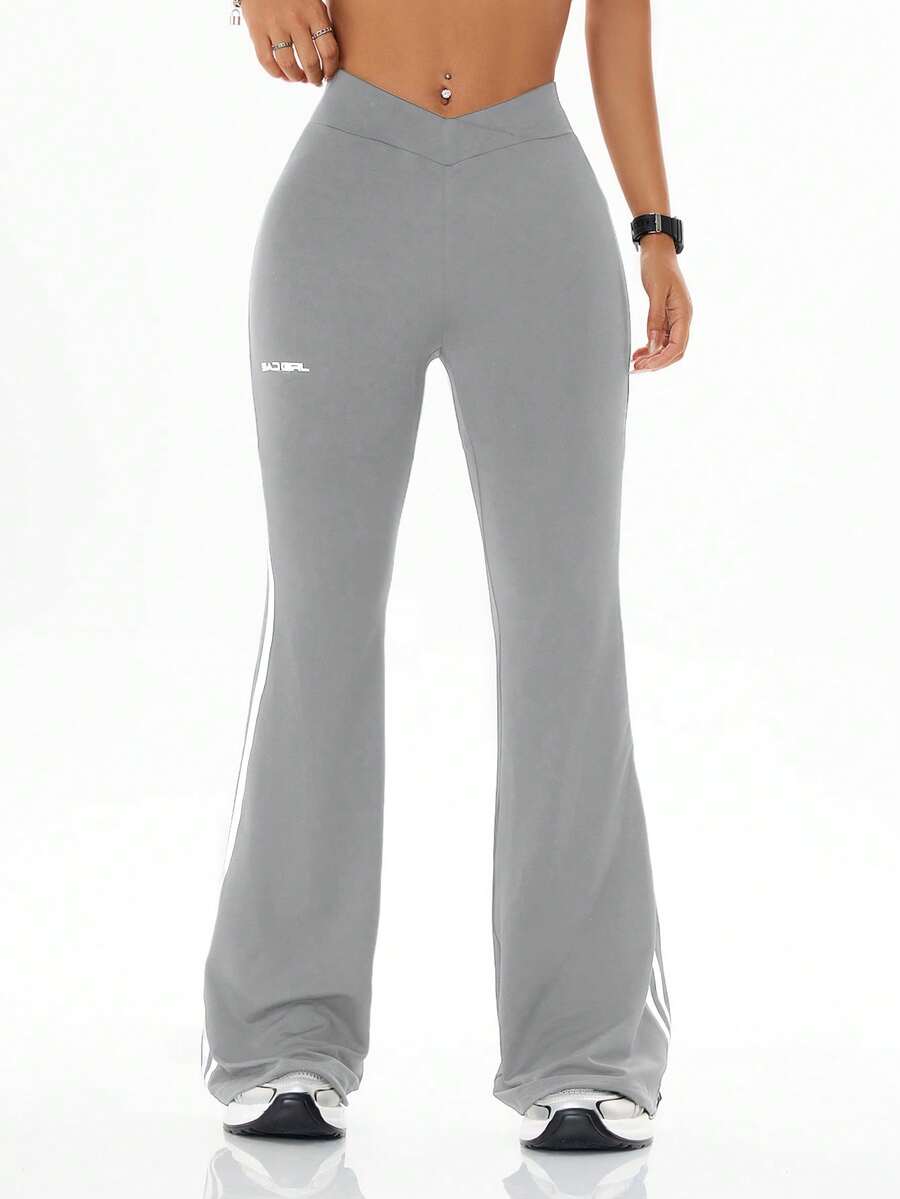 Women's high waist flare leg pants with side stripe tape detailing and an elastic waistband.