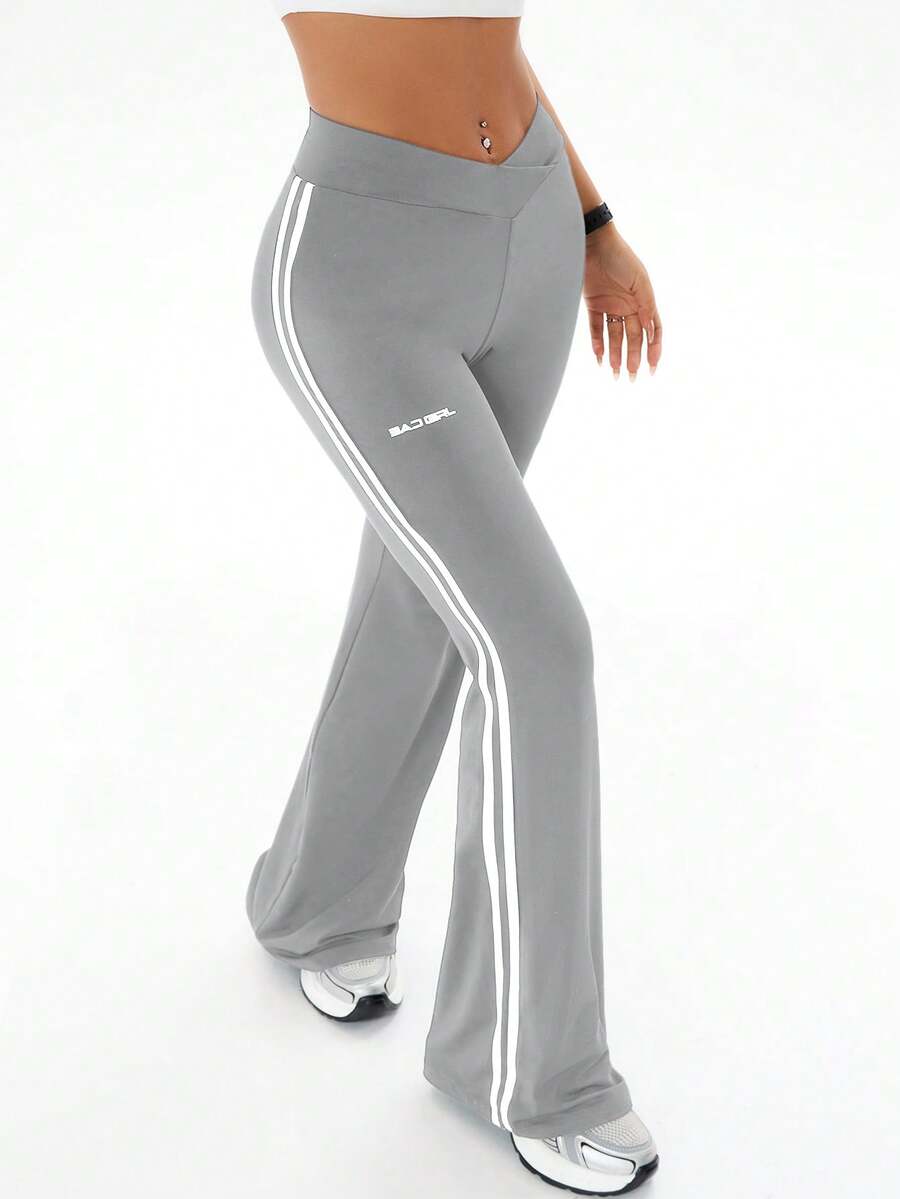 Women's high waist flare leg pants with side stripe tape detailing and an elastic waistband.