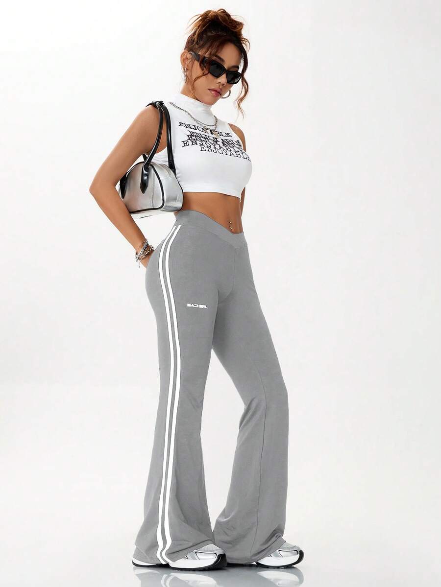 Women's high waist flare leg pants with side stripe tape detailing and an elastic waistband.