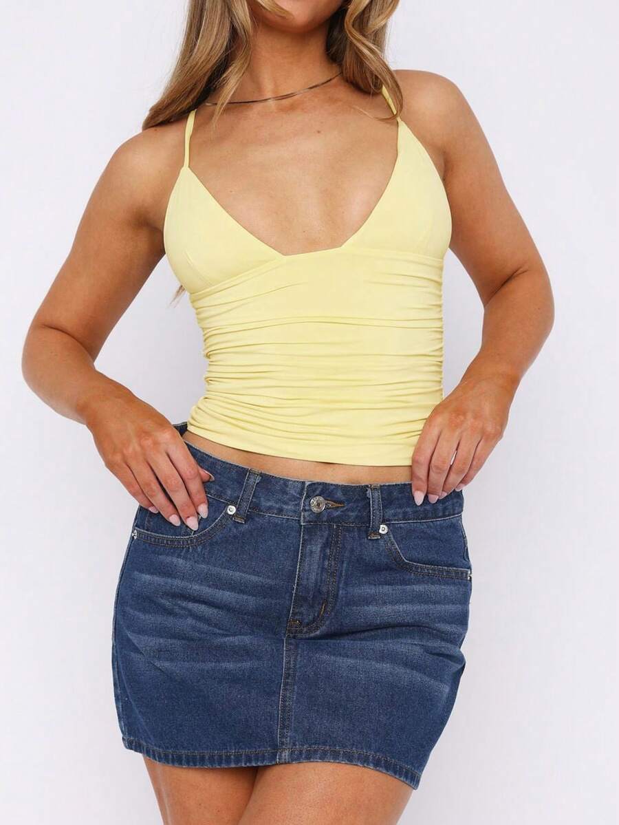 Women's red V-neck backless cami crop top with ruched details in a slim fit knitted style.