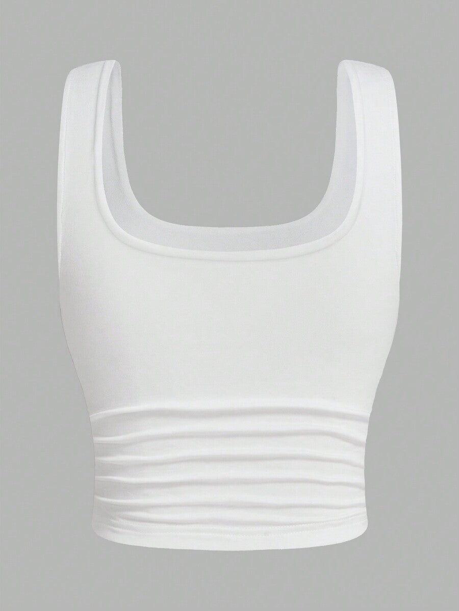 Women's knitted slim fit crop camisole tank top featuring a scoop neck and ruched detailing.