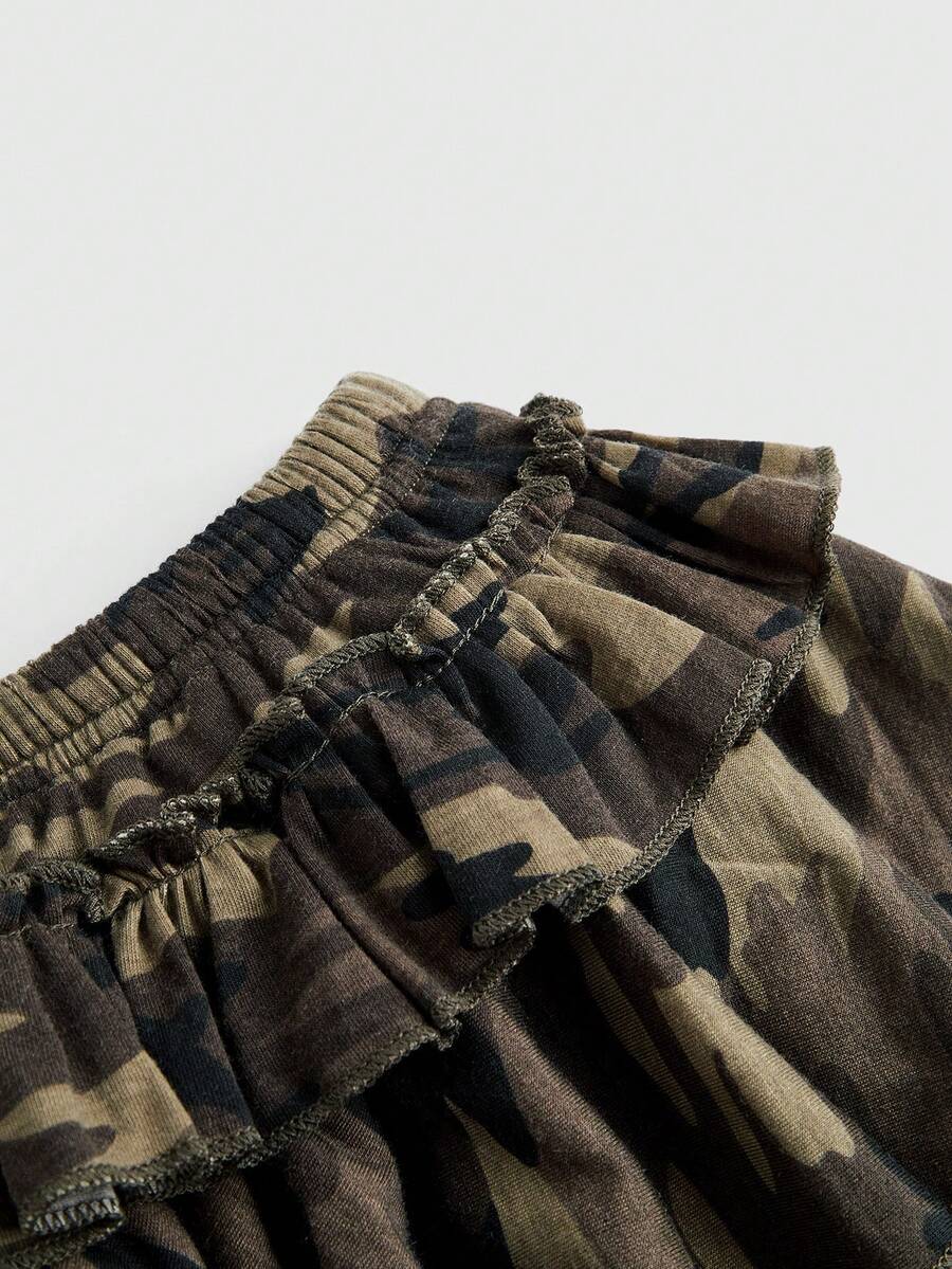 Women's low waist tiered mini skirt featuring ruffled hem layers in knitted stretch fabric.