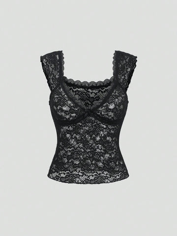 Black crop camisole top featuring wide shoulder straps, sweetheart neckline, and semi-sheer contrast lace detailing.