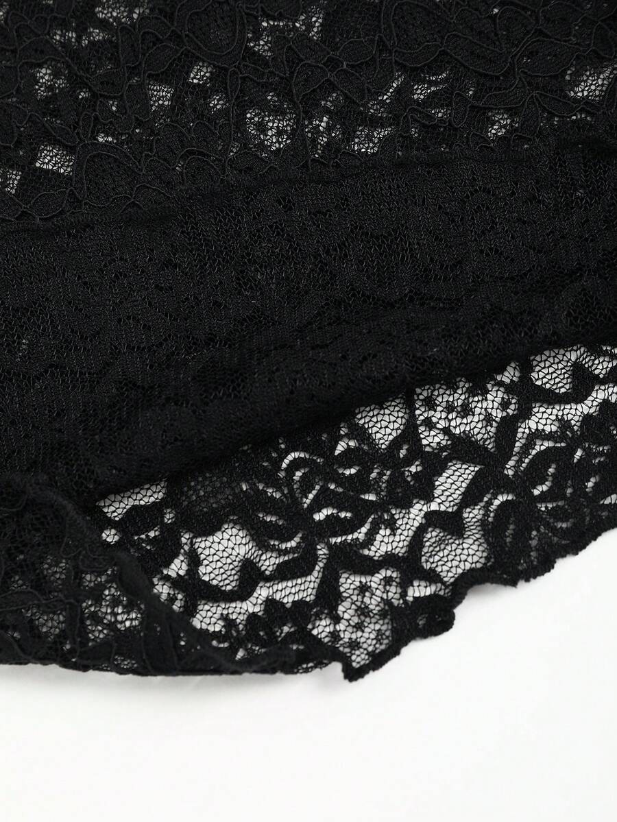 Black crop camisole top featuring wide shoulder straps, sweetheart neckline, and semi-sheer contrast lace detailing.