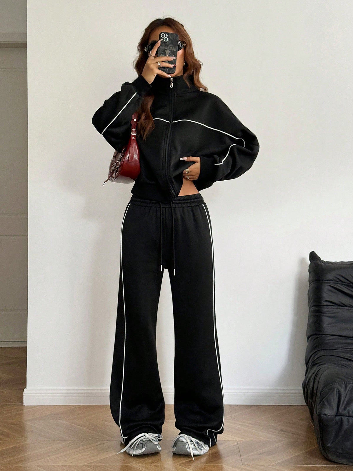 Women's two-piece casual set featuring a long sleeve zip-front hoodie and matching drawstring pants.